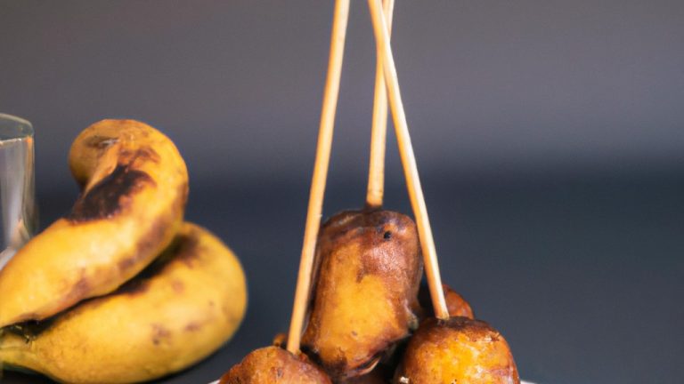 Uma panela de banana fatiada polvilhada com açúcar e canela em uma Airfryer. A banana é caramelizada e dourada, com um leve tom crocante.