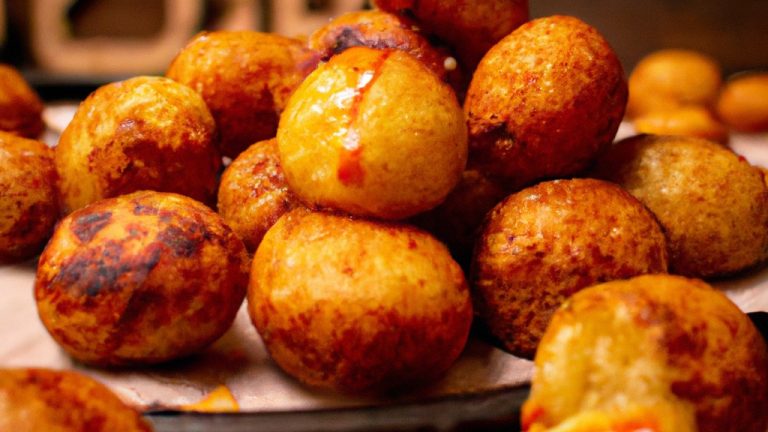 Imagem de uma Air Fryer com uma porção de entrevero frito no interior. O entrevero está dourado e crocante, com uma aparência suculenta e saborosa.