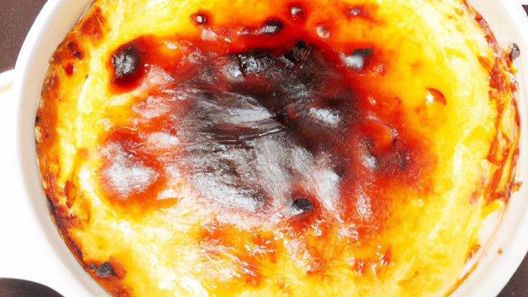 Imagem de filés de salmão grelhados em uma airfryer, acompanhados de brócolis e cenouras refogadas. O salmão está perfeitamente cozido, com uma crosta dourada e crocante, enquanto os vegetais estão crocantes e macios.