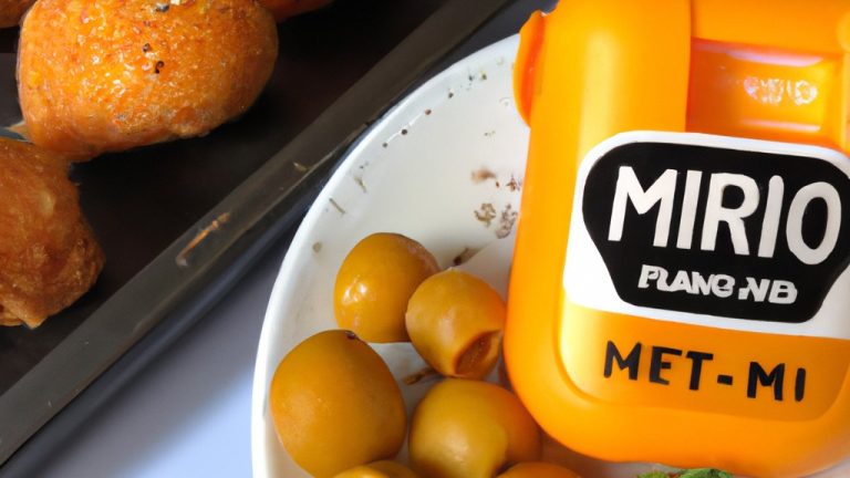 Imagem de espigas de milho grelhadas em uma cesta de fritadeira de ar, cobertas com uma mistura de mel e mostarda.