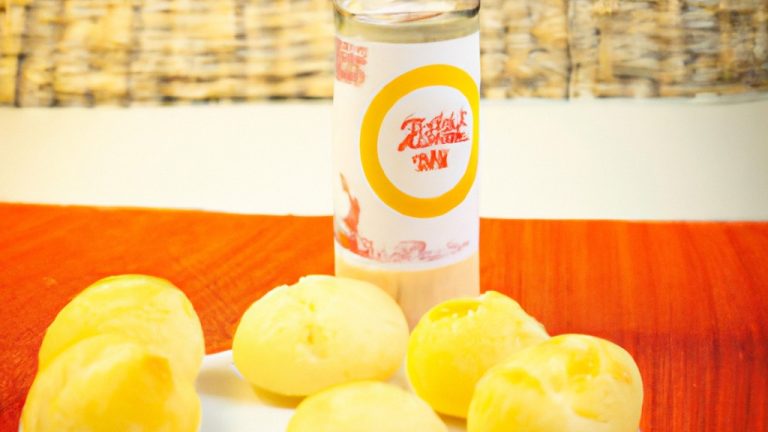 Imagem de mini pães de queijo congelados crocantes e dourados cozidos em uma airfryer, prontos para serem servidos em 20 minutos.