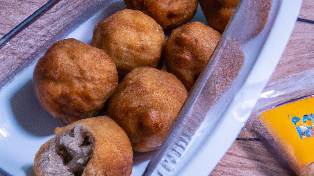 Imagem de nega maluca frita em uma AirFryer, com uma crosta crocante e um interior macio e fofo. A nega maluca é perfeitamente frita, com uma cor dourada e textura crocante, e é acompanhada por um molho de sua escolha.