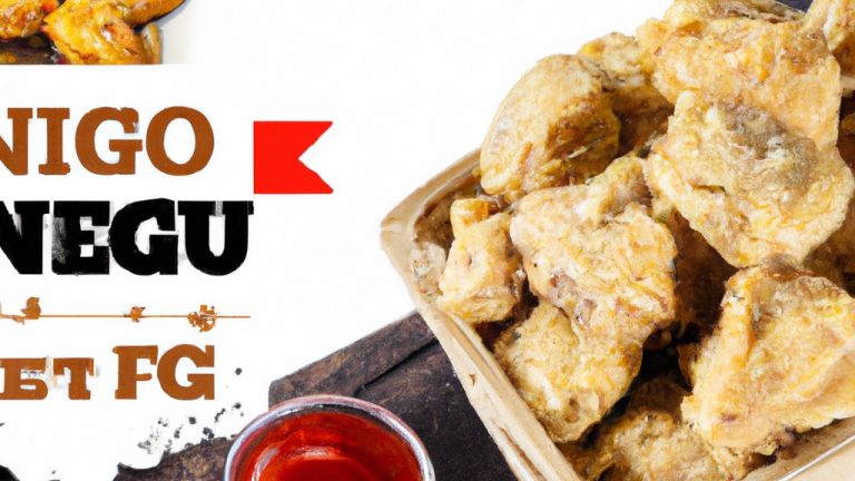 Foto de nuggets de frango dourados e crocantes dentro de uma airfryer com uma tigela de molho na lateral. Esses nuggets de frango são uma receita saborosa e fácil de almoço que pode ser feita rapidamente na airfryer.
