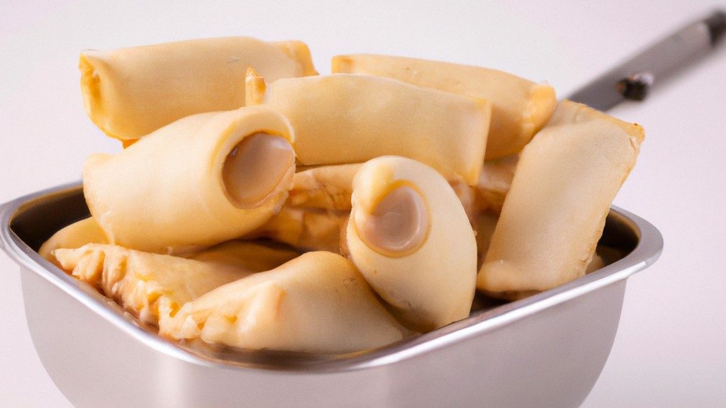 Imagem de pastéis de vento dourados e crocantes preparados na Airfryer, dispostos em um prato. A receita é fácil e rápida de fazer, resultando em pastéis deliciosos e perfeitos para lanches ou acompanhamentos.