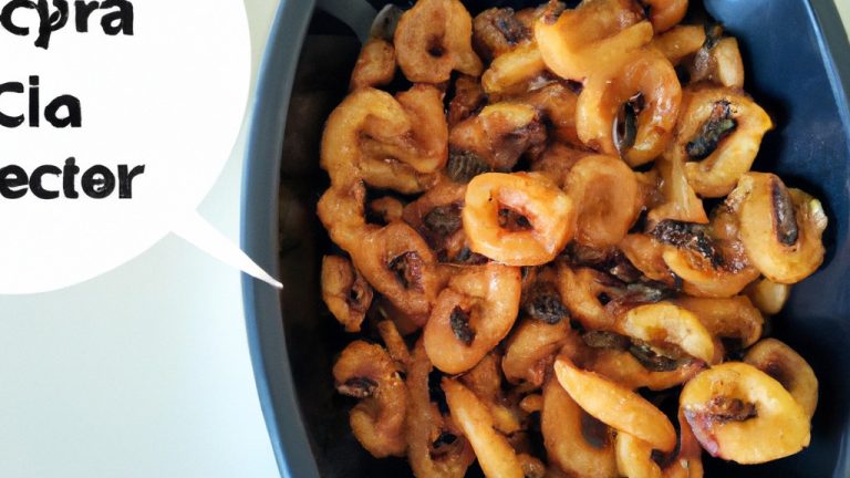 Imagem de uma porção de petiscos de feijão crocantes e dourados em uma cesta da airfryer. Os petiscos têm uma crosta crocante e um interior macio, com feijão preto e especiarias visíveis.