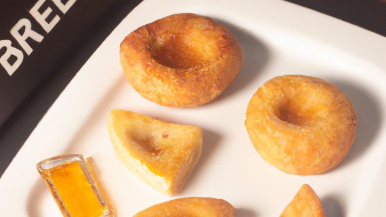 Imagem de um Brie assado na Airfryer, coberto com mel dourado. O queijo está derretido e borbulhante, com uma crosta crocante e dourada. Ao lado, há um prato de nozes e uma tigela de mel.