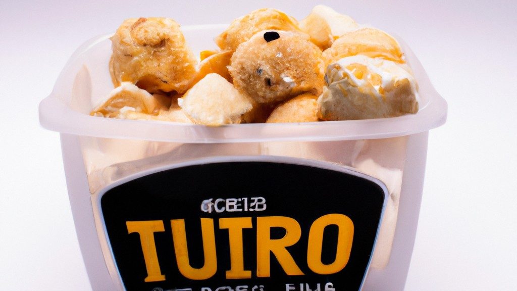 Imagem de um prato com fatias de queijo trufado derretidos e borbulhantes, preparados na Airfryer. O queijo está dourado e tem pequenas manchas pretas de trufas.