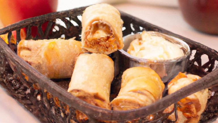 Uma foto de rosas de maçã e massa folhada feitas na airfryer. As rosas são feitas de fatias finas de maçã enroladas em massa folhada e assadas na airfryer até ficarem douradas e crocantes.