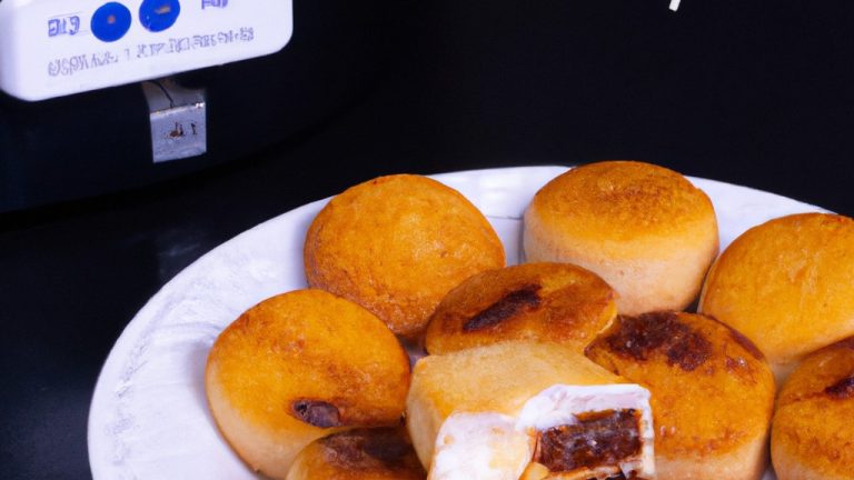 Foto de s'mores preparados em uma Airfryer. Os s'mores são feitos com biscoitos graham, marshmallows derretidos e barras de chocolate.