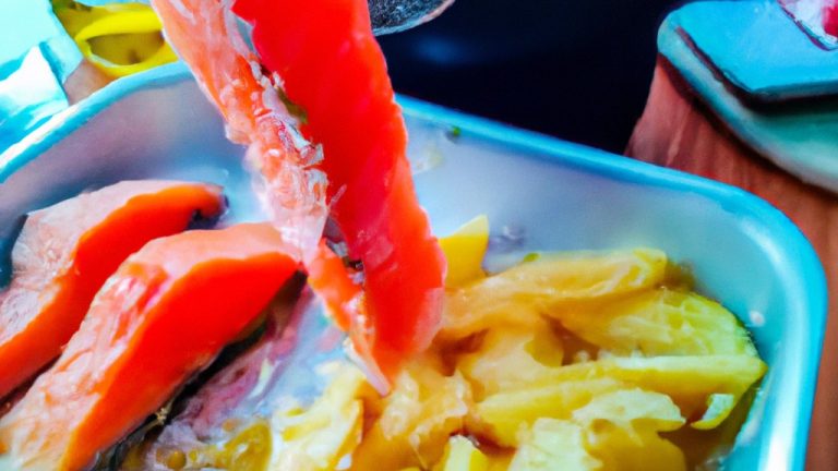 Imagem de um filé de salmão assado na Airfryer, coberto com ervas e azeite. O salmão está disposto sobre uma assadeira com furos, permitindo que o ar circule e crie um cozimento uniforme.