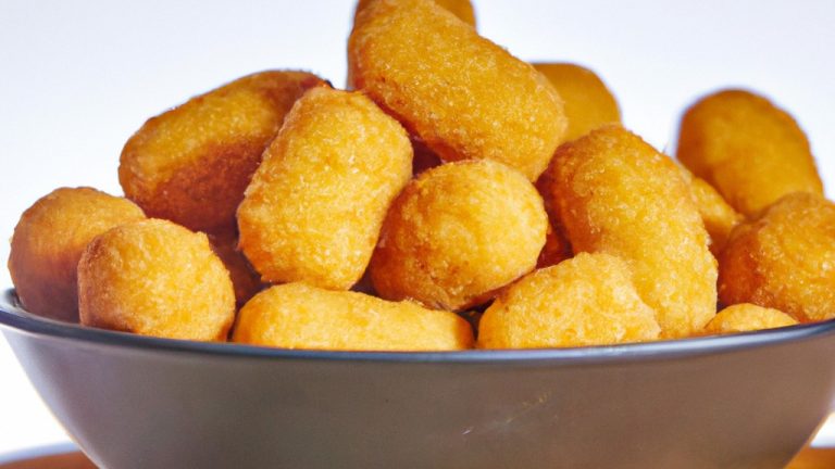 Uma imagem de uma Airfryer com várias comidas diferentes dentro, incluindo frango, batata frita e legumes. O texto na imagem diz "Airfryer: a maneira mais fácil de cozinhar alimentos deliciosos e saudáveis".
