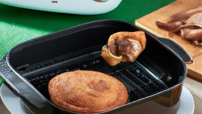 Imagem de uma fritadeira Air Fryer Black & Decker com um livro de receitas aberto ao lado. O livro de receitas contém uma variedade de receitas para fazer na fritadeira, incluindo batatas fritas, frango, peixe e vegetais. A fritadeira é de cor preta e tem um design elegante e moderno.