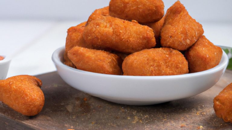 Imagem de uma Air Fryer Easy Fry da Arno, um aparelho de cozinha usado para fritar alimentos com pouco ou nenhum óleo. O aparelho é preto e tem uma cesta removível com uma alça.