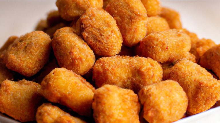 Imagem de um forno Air Fryer Oven Elgin. O forno é preto e tem uma porta de vidro. Há um botão giratório na frente do forno e uma alça na lateral.