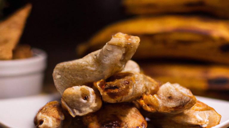 Imagem de bananas recheadas com nozes e canela, cozidas na Airfryer. As bananas estão cortadas ao meio e recheadas com uma mistura de nozes picadas, canela em pó e açúcar mascavo. Elas são colocadas em uma cesta da Airfryer e cozidas até ficarem douradas e macias.