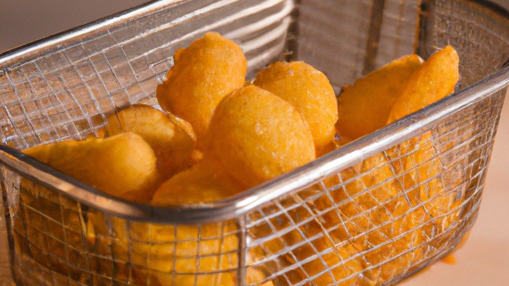 Imagem de uma fritadeira sem óleo Airfryer, um eletrodoméstico de cozinha usado para cozinhar alimentos com pouco ou nenhum óleo. Possui um cesto removível, onde os alimentos são colocados, e um elemento de aquecimento que circula ar quente ao redor do alimento, resultando em uma textura crocante sem a necessidade de óleo adicional.