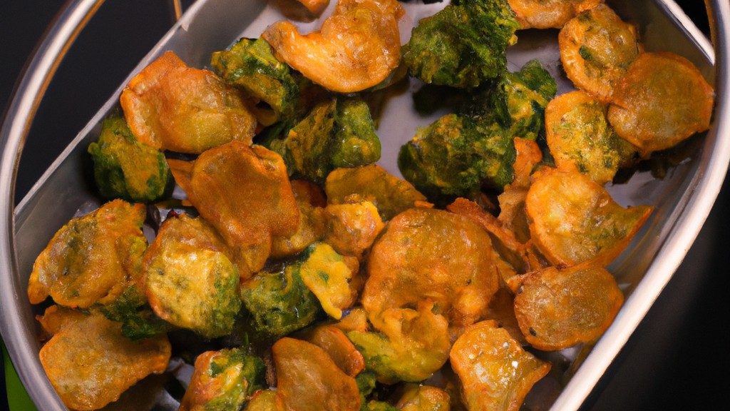 Imagem de couve-flor grelhada na Airfryer. A couve-flor é cortada em floretes e grelhada até ficar macia e dourada. É polvilhada com sal e pimenta e servida num prato.
