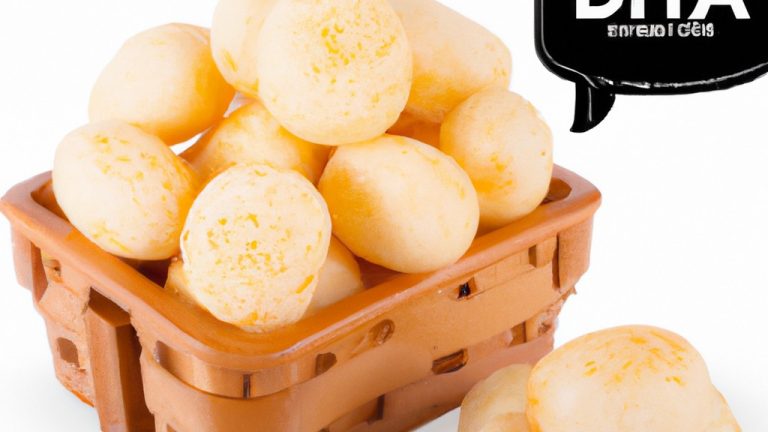 Dadinhos de tapioca crocantes feitos na Airfryer, servidos em um prato branco. Os dadinhos são dourados e têm um formato quadrado, com uma textura crocante e um interior macio. A imagem mostra o prato de cima, com os dadinhos dispostos de forma aleatória.