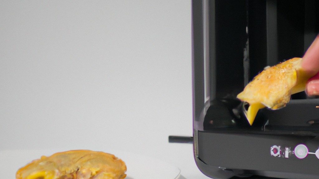 Imagem de uma lasanha cozida em uma Airfryer. A lasanha é cortada em fatias e colocada em uma assadeira. A parte superior da lasanha está dourada e borbulhante, e o queijo está derretido e escorrendo pelas laterais.
