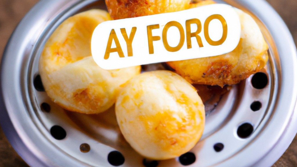 Imagem de nuvens de ovos fofas e douradas preparadas em uma Airfryer. As nuvens de ovo são moldadas em divertidas formas de nuvem e têm uma textura crocante por fora e macia e fofa por dentro.