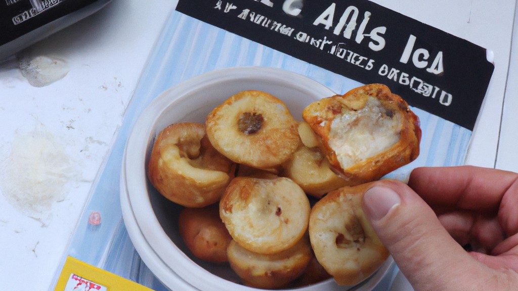 Imagem de pão de alho caseiro crocante e dourado cozido em uma Airfryer. O pão é coberto com queijo derretido, ervas e manteiga de alho.