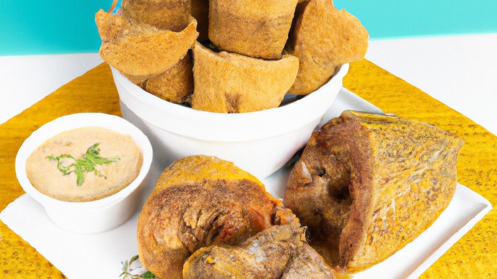 Imagem de um prato com peixe frito em formato de porquinho, preparado na airfryer. O peixe é dourado e crocante, com olhos, nariz e orelhas feitos de azeitonas e cenouras.
